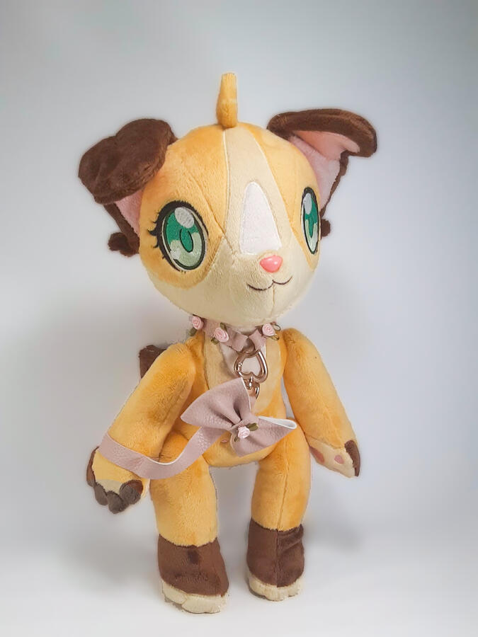 Lacy (2020) A jointed orange and brown anthro dog plush with a pink collar and leash