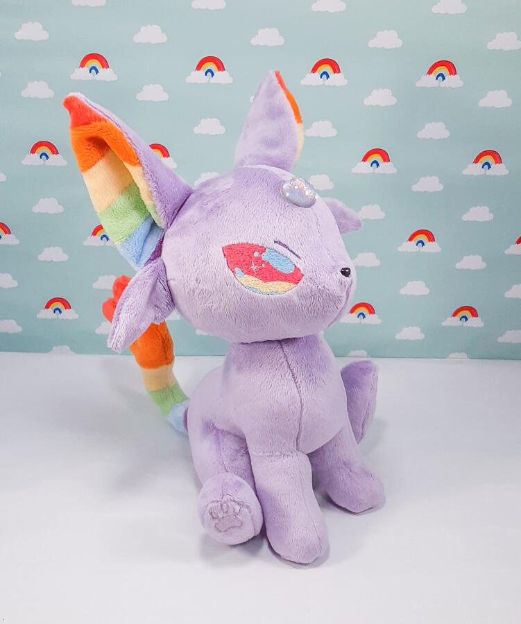 Rainbow Espeon (2019) Espeon plush with rainbow accents