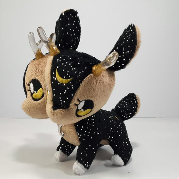 Solstice Doppel Reindeer A sparkling black two-headed deer plush with gold accents and clear horns