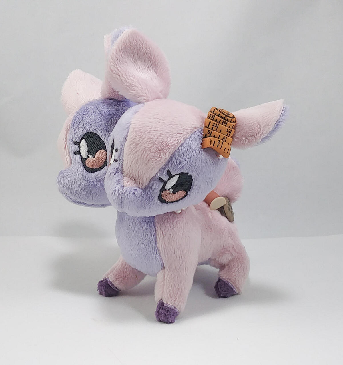 A pink snail-cat lays lazily against a blue backround with text reading "take it slow"